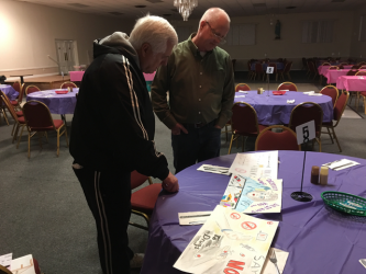 2018 - Brothers John and Chris review submissions to the Drug and Alcohol Awareness Poster contest.